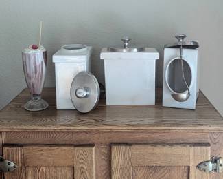 Vintage kitchenware and serving pieces in a mix of materials and eras.