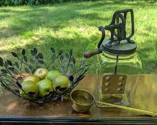 Vintage kitchen and garden finds, including an old chair and brass pieces.