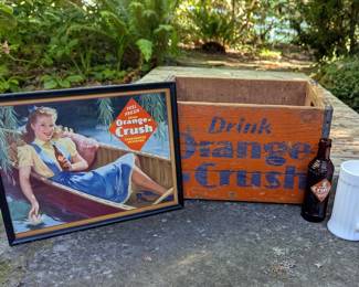 Colorful vintage Crush advertising and collectible tins.