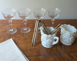 Crystal stemware with vintage barware and serving accessories.
