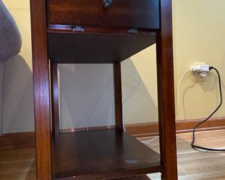 Tufted Leather Ottoman with Turned Legs and Casters