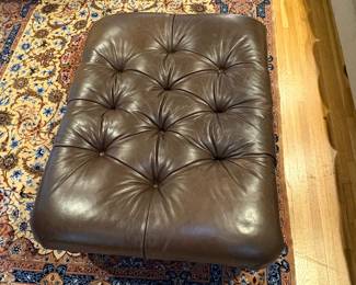Tufted Leather Ottoman with Turned Legs and Casters