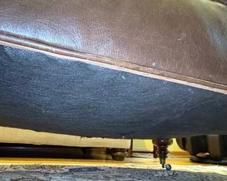 Tufted Leather Ottoman with Turned Legs and Casters