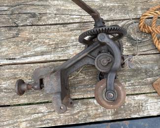 Antique Deering hand-crank implement grinder