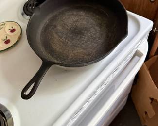 Large unmarked cast-iron skillet with heat ring