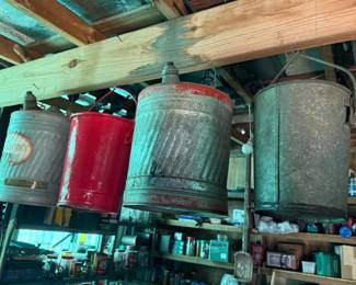 Four hanging metal utility containers, including two apparent bucket pendant-light shades