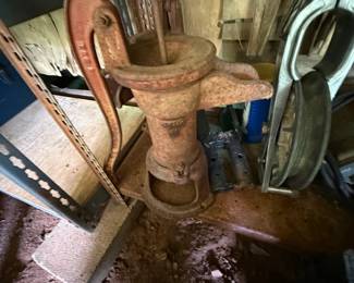Two antique-style cast-iron hand water pumps