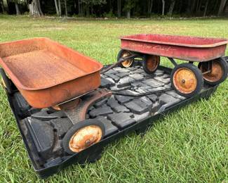 Pair of vintage red metal wagons