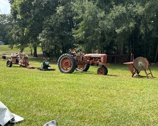 Farmall tractor and farm-equipment auction scene