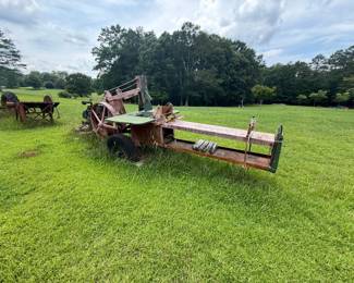 Older belt-driven stationary hay press or hay baler