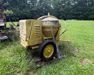 Towable rotating-drum concrete mixer with gasoline engine enclosure