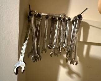 Pegboard-mounted assortment of hand tools