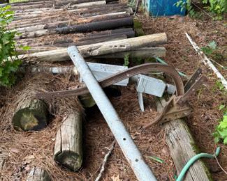 Group of weathered farm implements and mechanical screw jacks - additional view