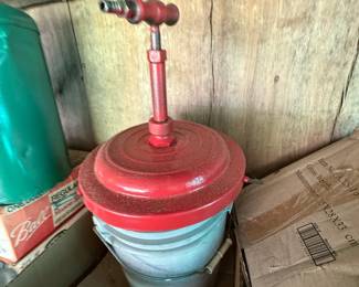 Two painted metal hand-pump tank sprayers