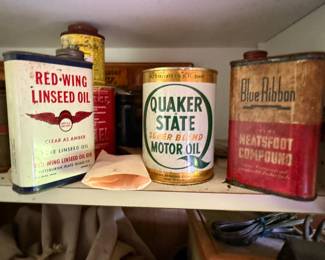 Cabinet group: two mechanical dial scales, branded oil tins, and threaded fittings - additional view
