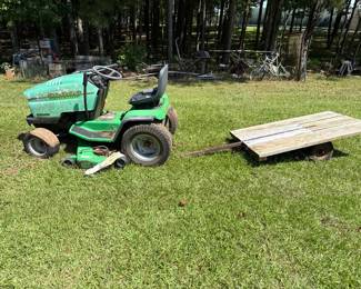 John Deere Sabre riding mower with utility trailer