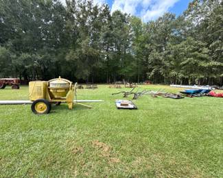 Wide auction setup with tractors and equipment