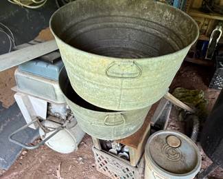 Two galvanized metal wash tubs with side handles