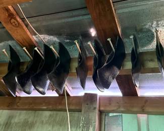 Group lot of black-painted agricultural plow points/sweeps