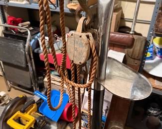 Floor-standing hand-cranked apparatus with wooden block-and-tackle rigging