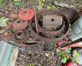 Lot of assorted antique agricultural-machine sprockets and cast-iron drive parts