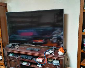Samsung 65" 4K Ultra HD Smart TV with curved display.