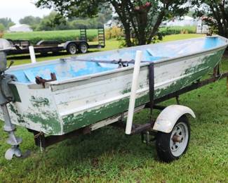 12' aluminum boat w trailer. Motor incl. as is.