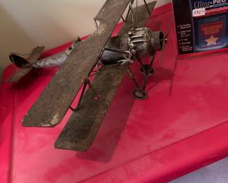 Vintage Brutalist-style biplane sculpture crafted from welded scrap metal