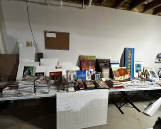 Dozens of art bookds, art supplies, paints and brushes