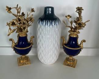 Cobalt Blue and Gold Tone Decorative Urns With Floral Arrangements and Textured White Vase