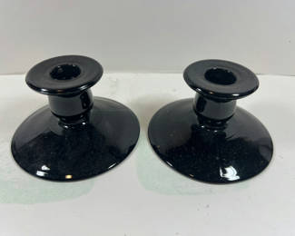 Lot 91: Pair of black glass candle holders