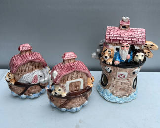 Lot 148: Three ceramic figurines: salt and pepper shakers pink-roofed houses and a brick-tower scene