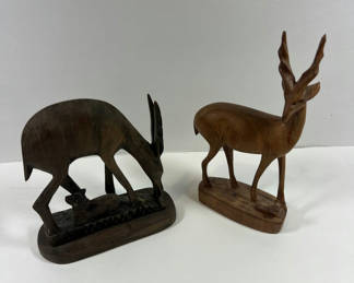 Lot 69: Two wooden deer figurines (doe with fawn and standing stag)