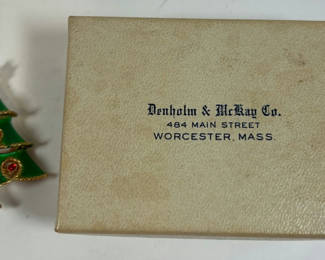 Lot 79: Green enamel Christmas tree brooch in Denholm & McKay jewelry box