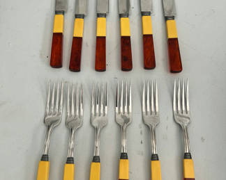 Lot 54: Two-tone yellow and brown handled cutlery set (knives and forks)