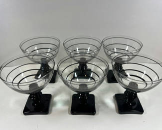 Lot 90: Six spiral-striped coupe glasses with black stems