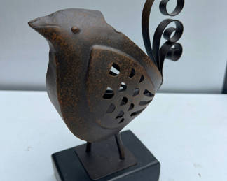 Lot 117: Rusty metal bird sculpture on a black pedestal