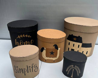 Lot 123: Decorative NESTING round storage boxes with home-themed artwork