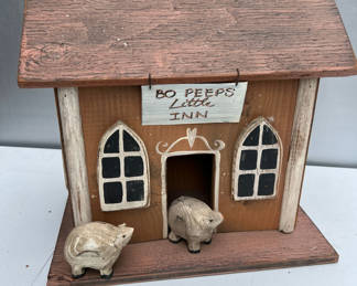 Lot 147: Decorative wooden inn with pig figures