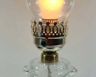 Lot 82: Glass hurricane lamp with crystal base and brass fittings
