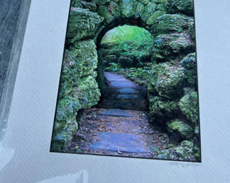 Lot 56: Scott Matyjaszek ARTEPHAX PHOTOGRAPHIC Moss-covered rock archway with path