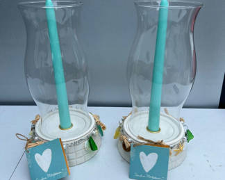 Lot 135: Pair of coastal candle holders with teal candles