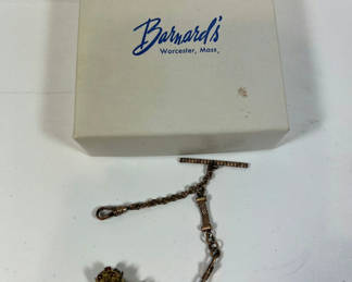 Lot 77: Vintage brass-tone bracelet with ivory tooth pendant