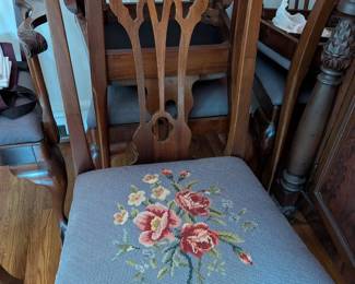 Needlepoint seat of Chippendale inspired dining chairs (8 total)
