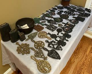 Collection of Vintage Cast Iron and Brass Trivets, Bells, and Coffee Grinder