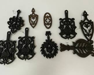Collection of Nine Vintage Cast Iron Trivets