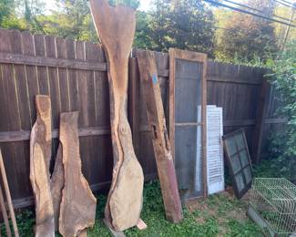 Live edge slabs, antique barn beams, skinny screen doors, shutters, a window that is in excellent condition and some old bird cages. 