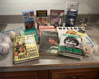 Sports books and signed baseballs, plus Cubs baseball
