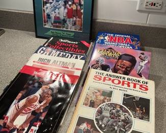 Sports books and signed Bob Griese football picture