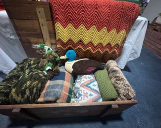 Blankets, afghans in old wooden box